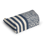 Navy cream zebra striped makeup bag lying flat showing the T-bottom shape