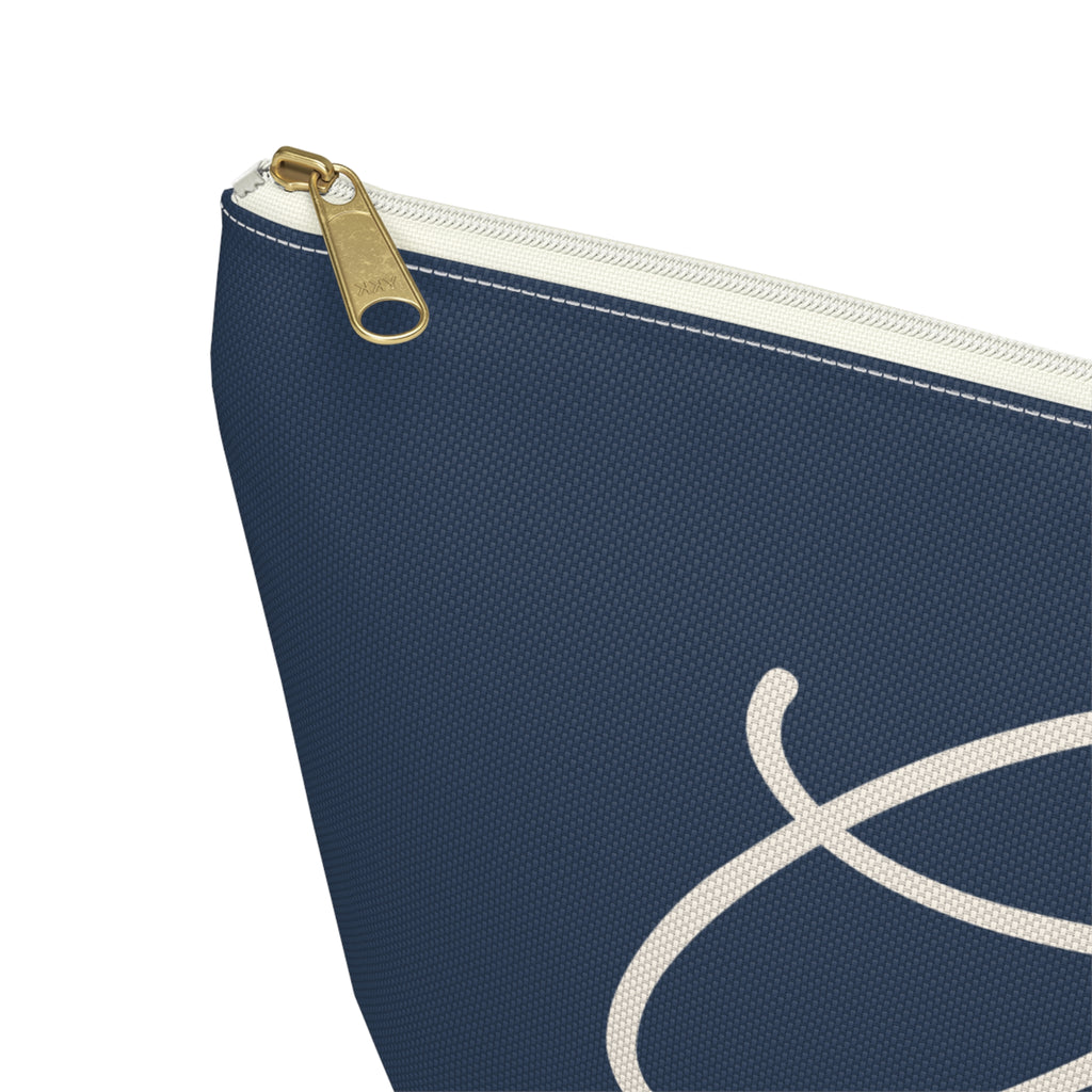 Close-up of the gold zipper pull on the Navy White Monogram personalized makeup bag