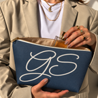 Hands holding the open Navy White Monogram personalized makeup bag