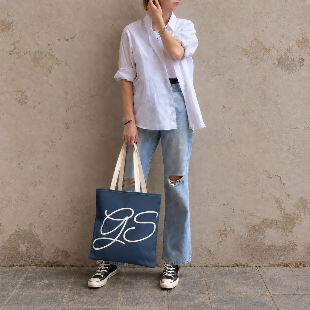 Model standing outdoors with the Navy White Monogram personalized tote bag in a full-body photo