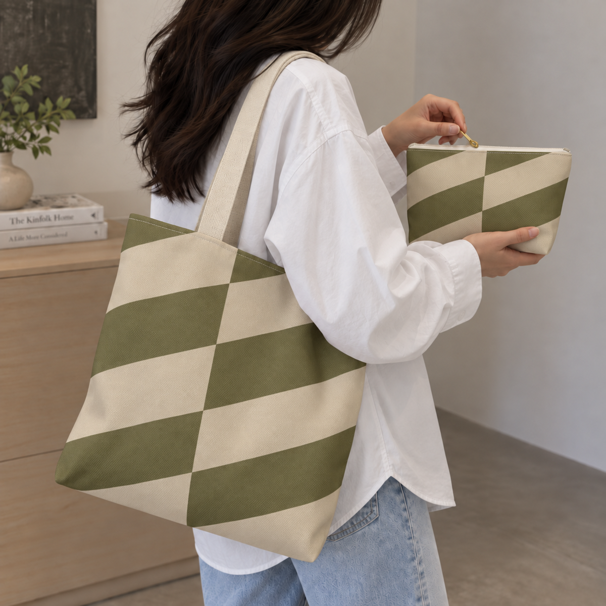 Woman carrying the olive beige geometric tote bag while holding the matching makeup bag