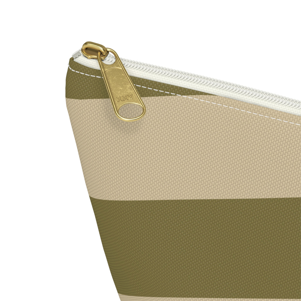 Close-up of the gold zipper pull on the olive beige geometric makeup bag