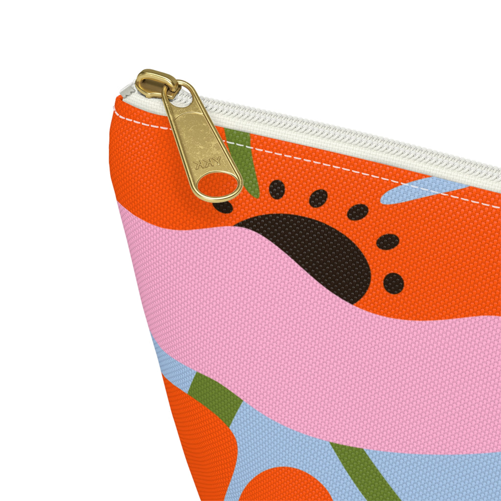 Close-up of the gold zipper pull on the orange poppy floral makeup bag