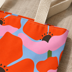 Close-up of the big orange poppies on pink and blue on the floral tote bag