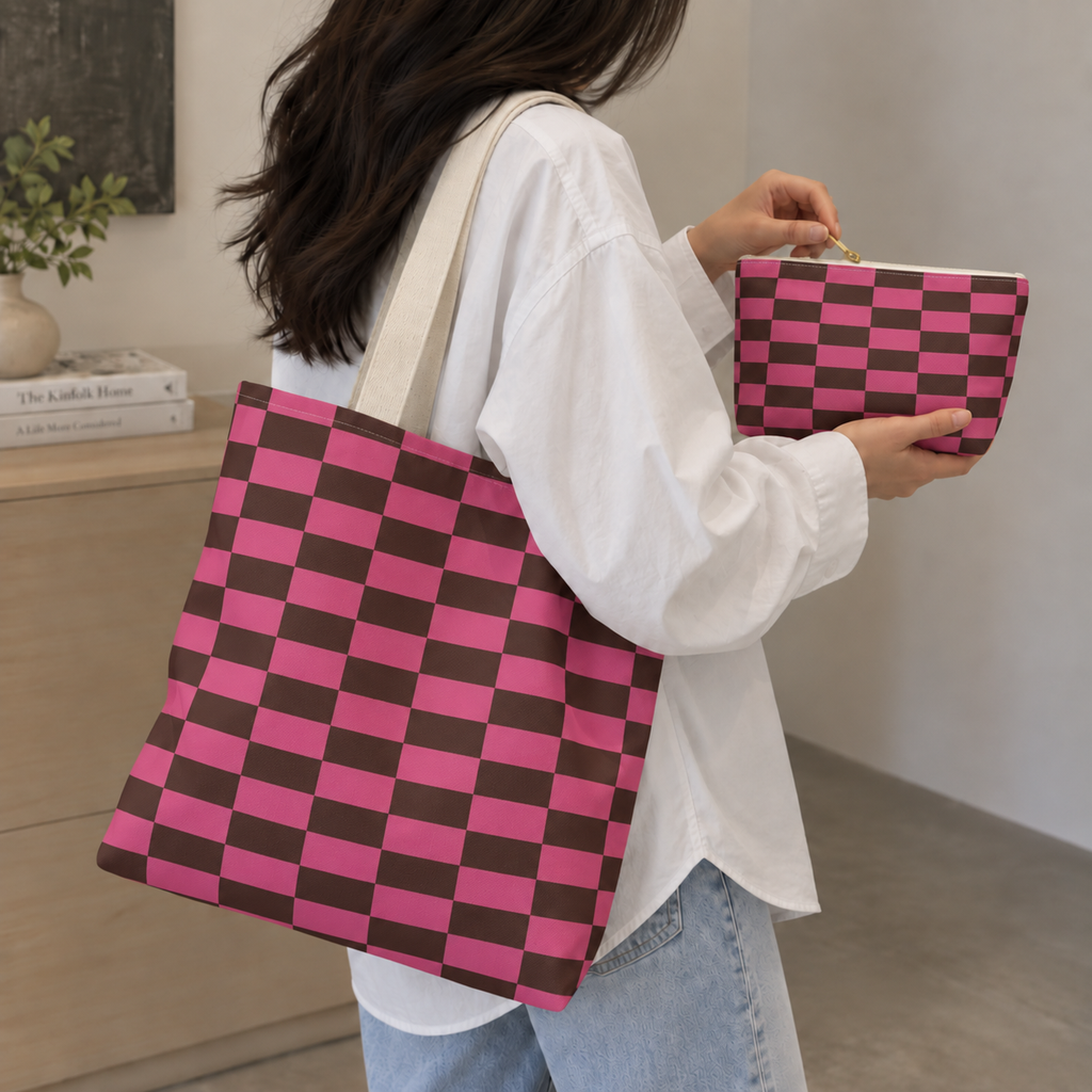 Woman carrying the matching tote bag and holding the pink brown checkered makeup bag