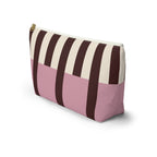 Side view of the pink burgundy cream striped makeup bag with flat T-shaped bottom