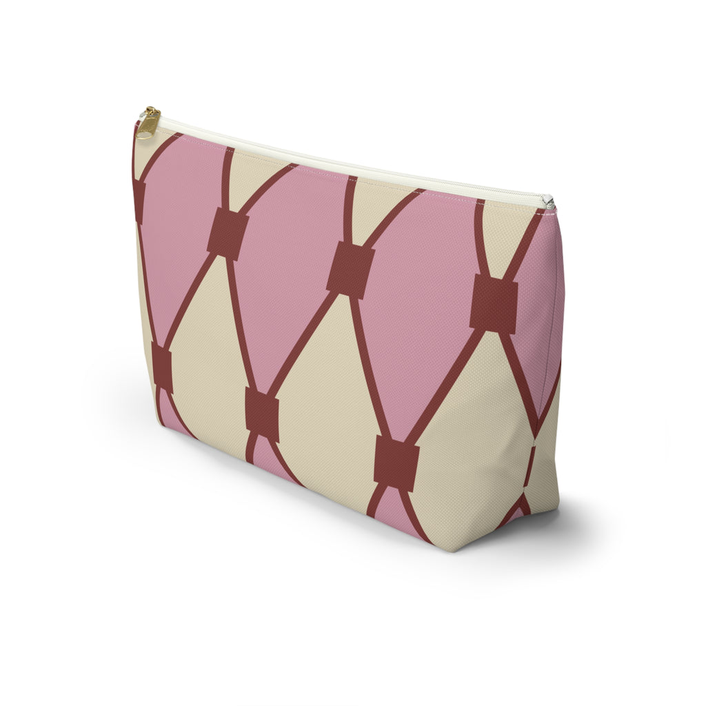 Pink cream diamond pattern makeup bag standing at an angle