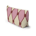 Pink cream diamond pattern makeup bag standing at an angle