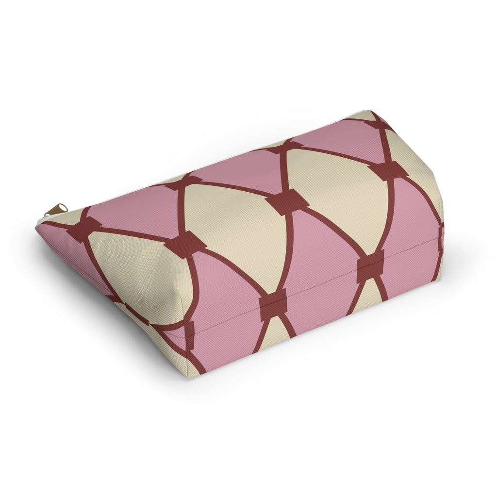 Side view of the pink cream diamond pattern makeup bag lying down