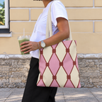 Woman walking with the pink cream diamond pattern tote bag on her shoulder