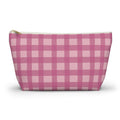 Pink gingham makeup bag with gold zipper pull on a white background