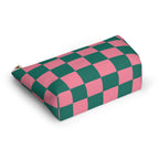 Pink green checkered makeup bag lying at an angle on a white background