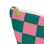 Close-up of the gold zipper pull on the pink green checkered makeup bag