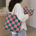 Woman carrying the pink green checkered tote bag with the matching makeup bag