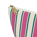 Close-up of the pink, green and cream stripes and gold zipper pull on the makeup bag