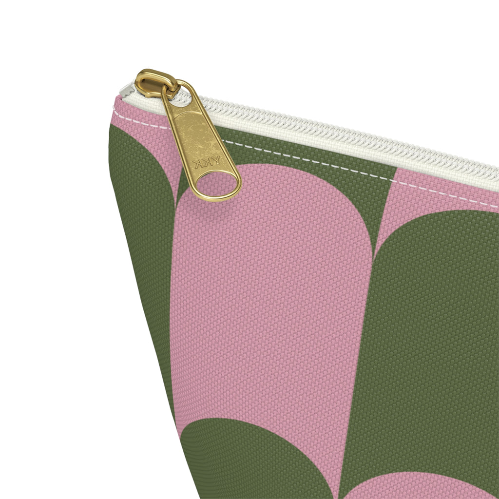 Close-up of the gold zipper pull on the pink green scallop makeup bag