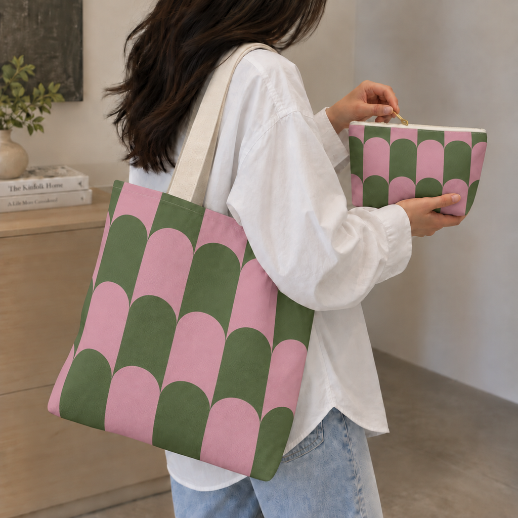 Woman in a white shirt carrying the pink green scallop tote bag with the matching makeup bag