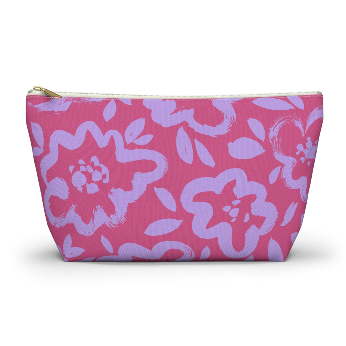 Pink makeup bag with lavender flowers and gold zipper pull on a white background