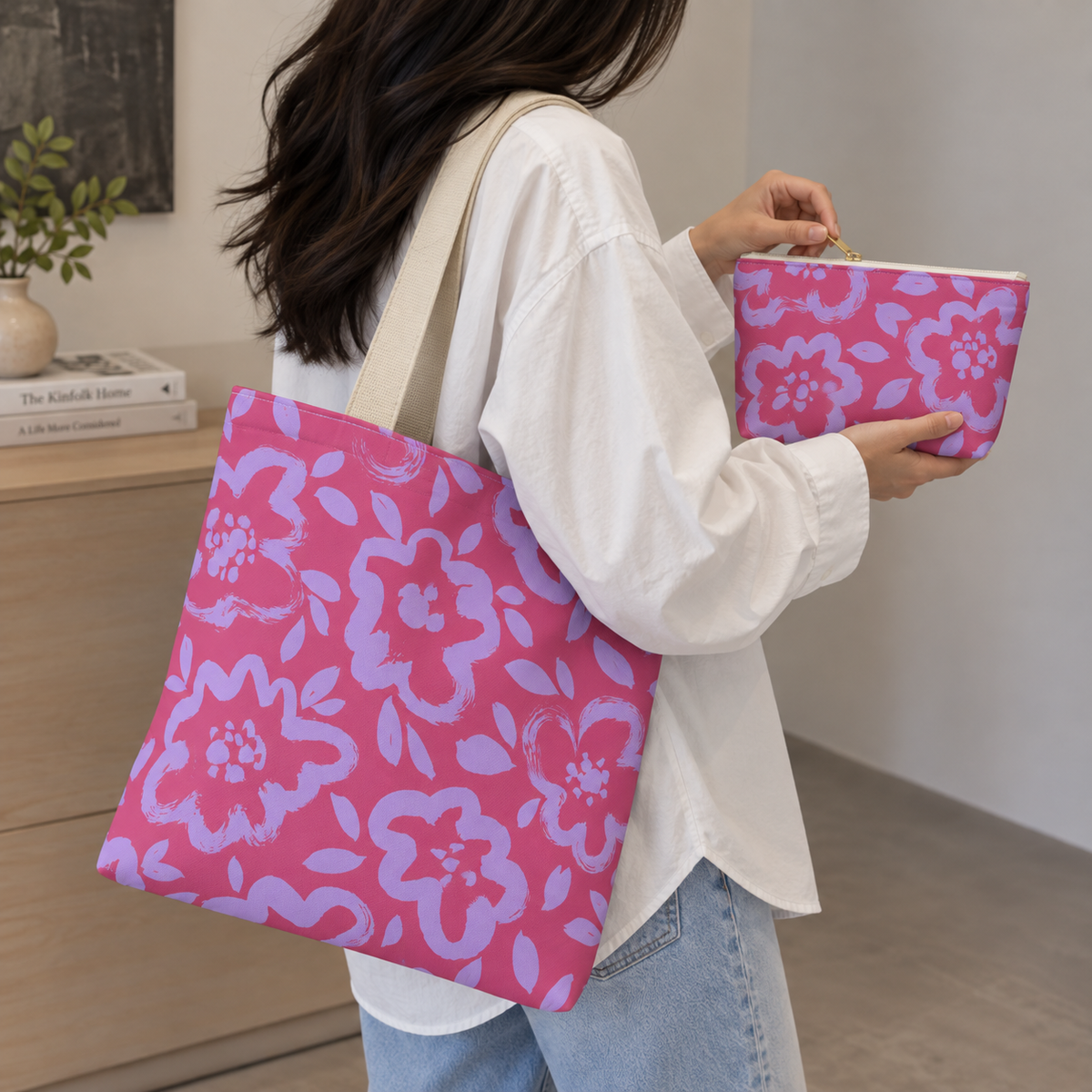 Woman carrying the floral tote bag with the matching pink lavender makeup bag