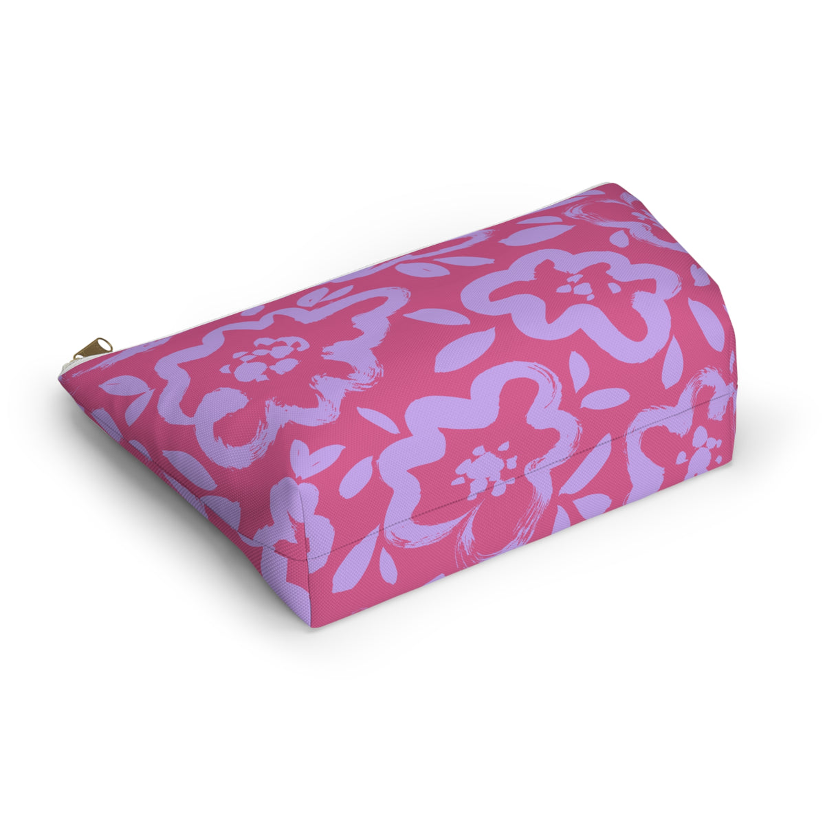 Pink lavender floral makeup bag lying at an angle on a white background