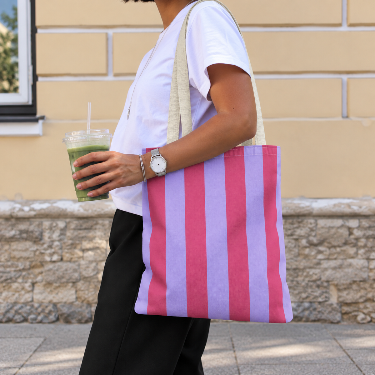 Woman walking with the Pink Lilac Striped tote bag on her shoulder