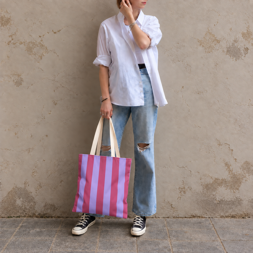 Full-length model photo with the Pink Lilac Striped tote bag against a wall