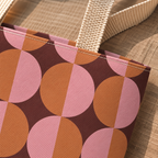 Close-up of pink, orange and burgundy half circle geometric print on a tote bag