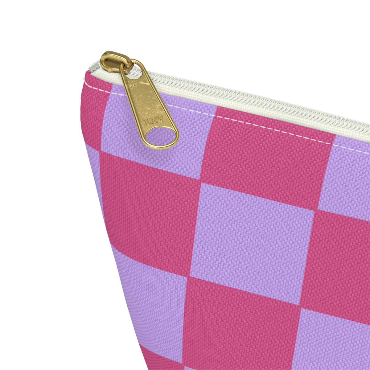 Close-up of the gold zipper pull on the pink purple checkered makeup bag