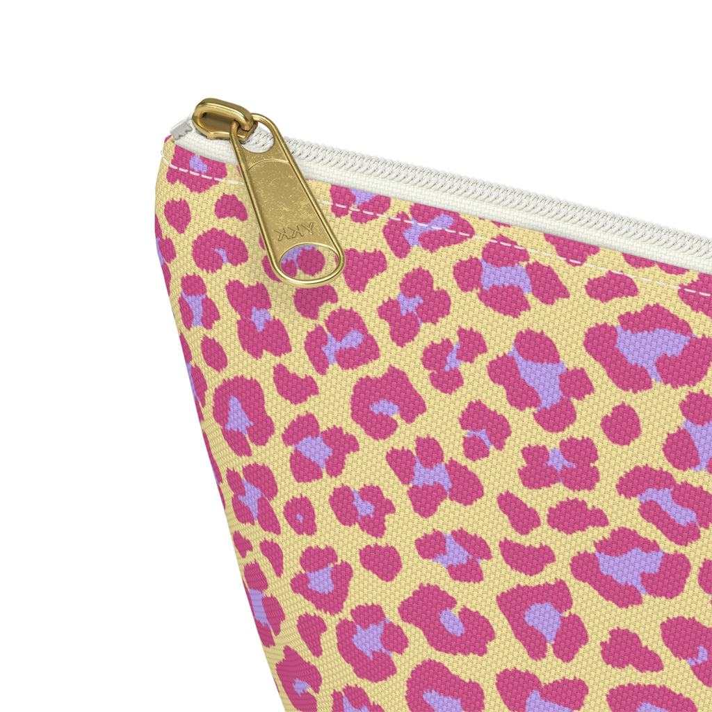 Close-up of the gold zipper pull and pink purple leopard spots on the makeup bag