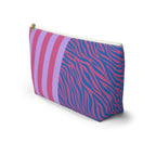 Zebra stripe makeup bag with T-shaped bottom and gold zipper pull seen from the side