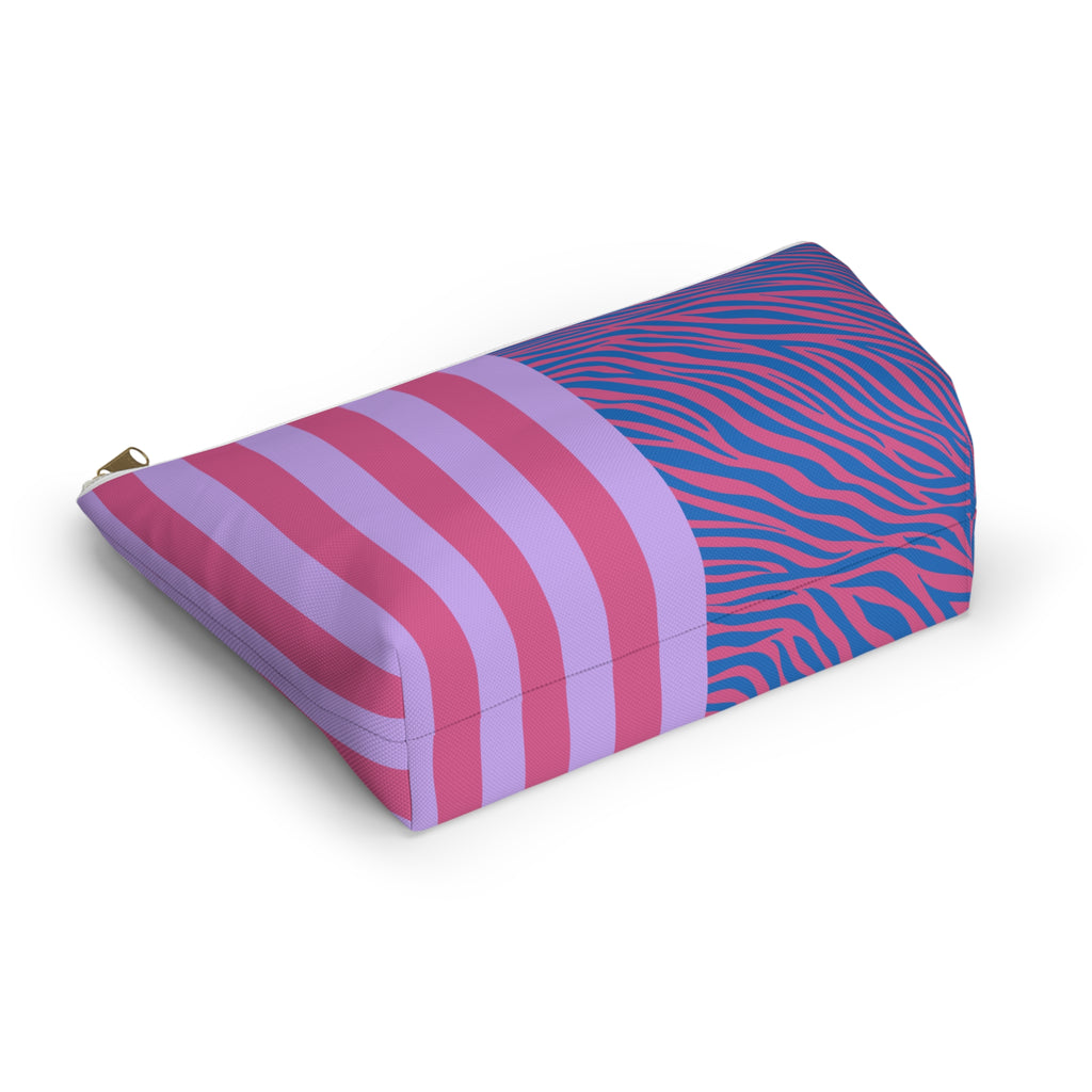 Pink and lilac striped cosmetic bag lying on its side
