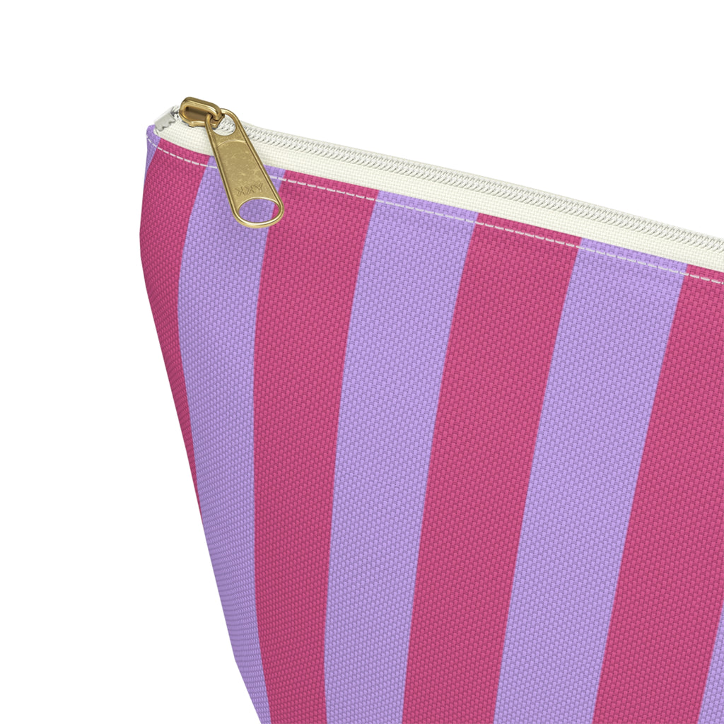 Close-up of the gold zipper pull and pink lilac stripes on the makeup bag