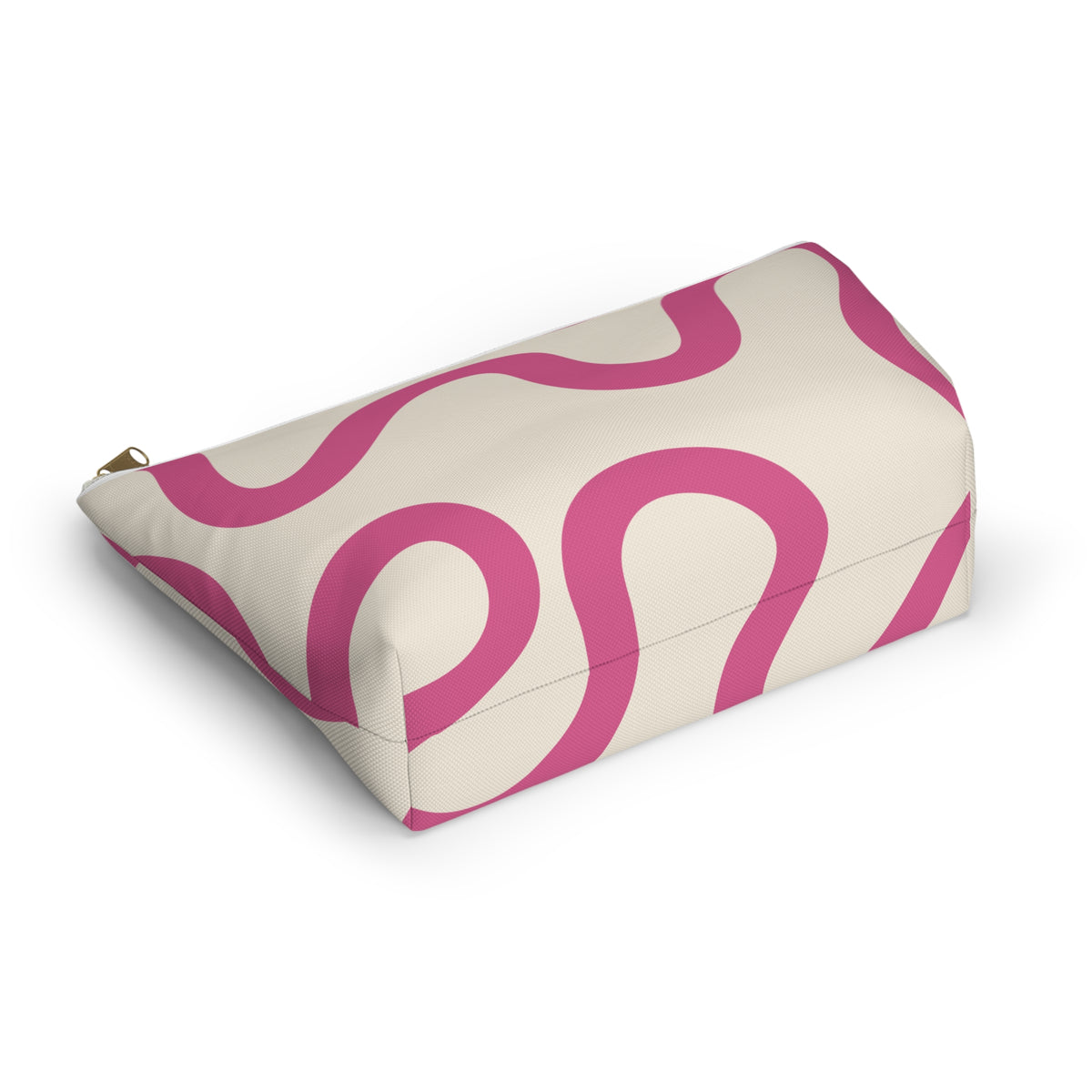 Pink wavy line makeup bag lying on its side