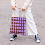 Woman in white trousers carrying the purple burgundy diamond checkered tote bag