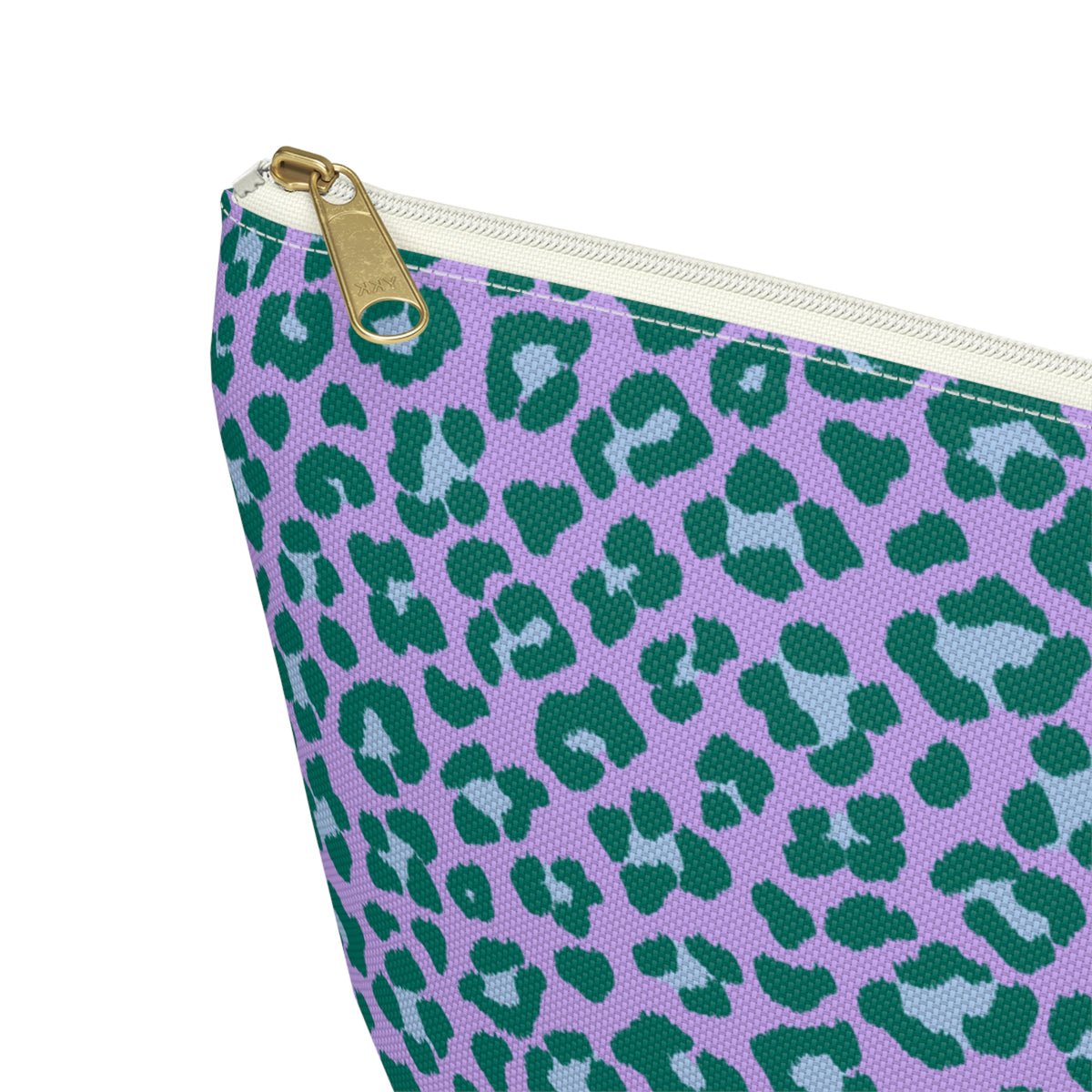 Close-up of the gold zipper pull and green leopard spots on lavender makeup bag