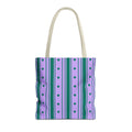 Purple green striped tote bag with cream handles on a white background