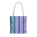 Purple green striped tote bag with cream handles on a white background