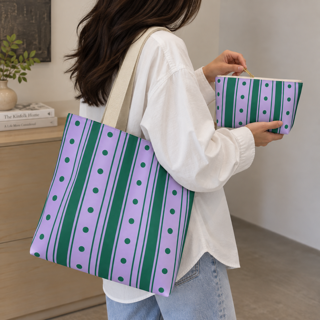 Woman carrying the purple striped tote bag next to the matching makeup bag
