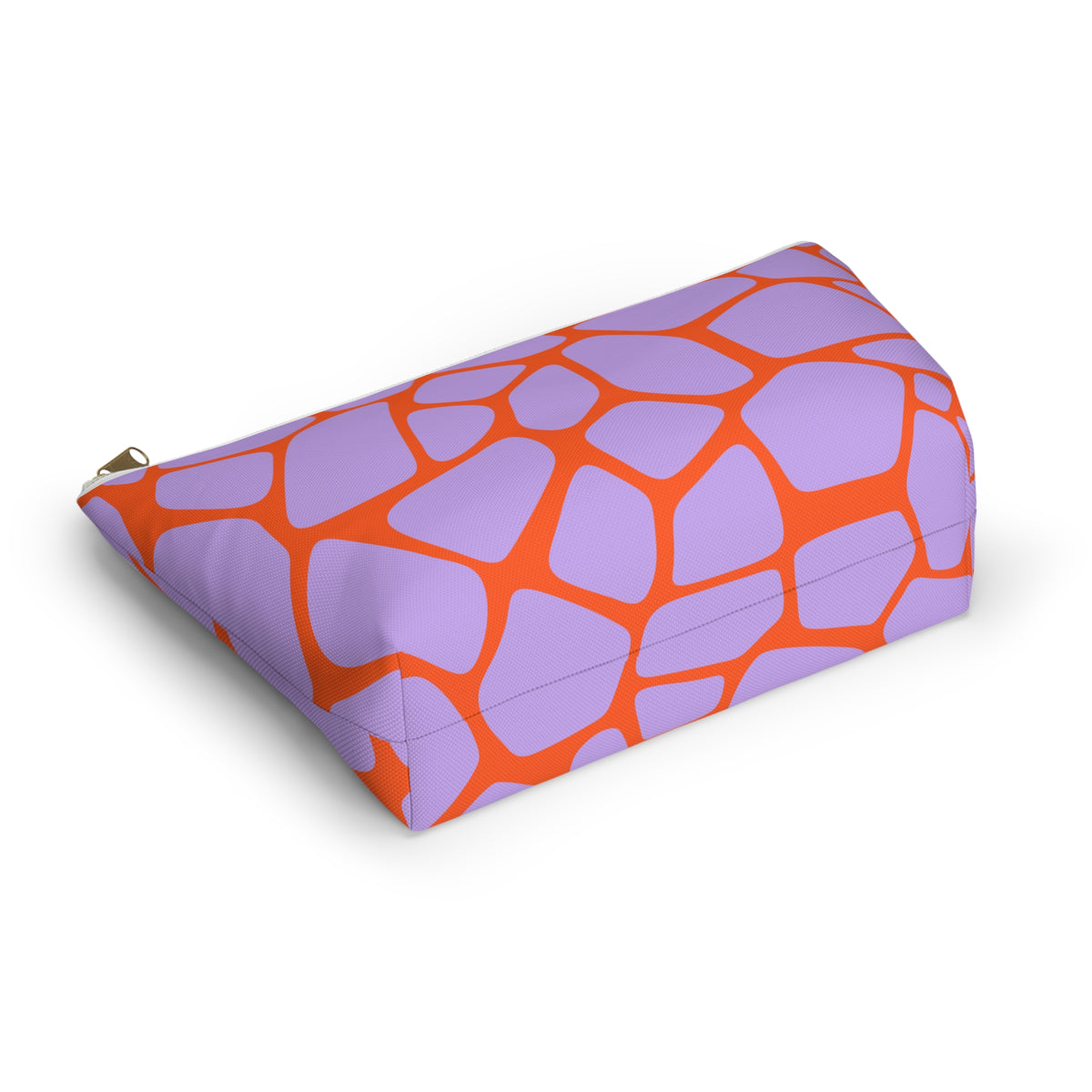 Side view of the purple orange giraffe print makeup bag lying down