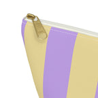 Close-up of the purple and yellow stripes and gold zipper pull on the makeup bag