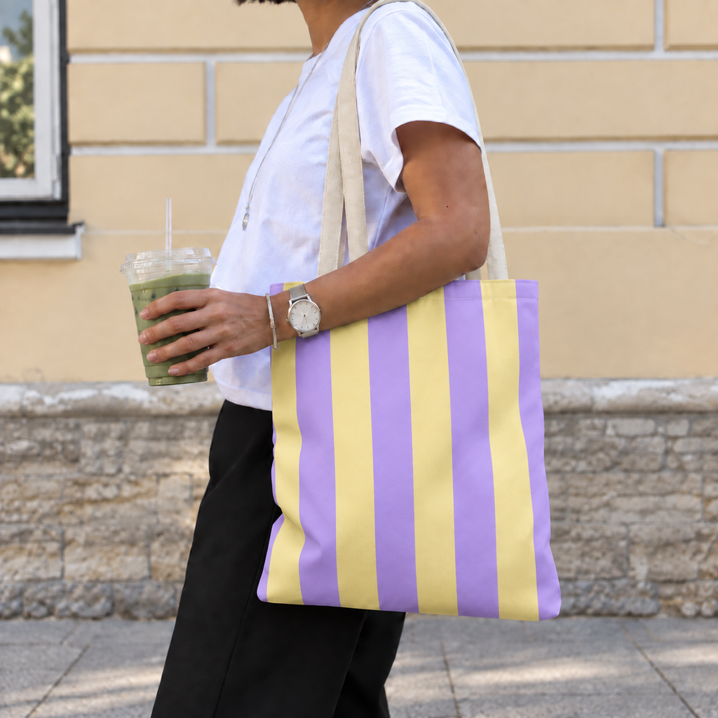 Woman walking with the Purple Yellow Striped tote bag on her shoulder