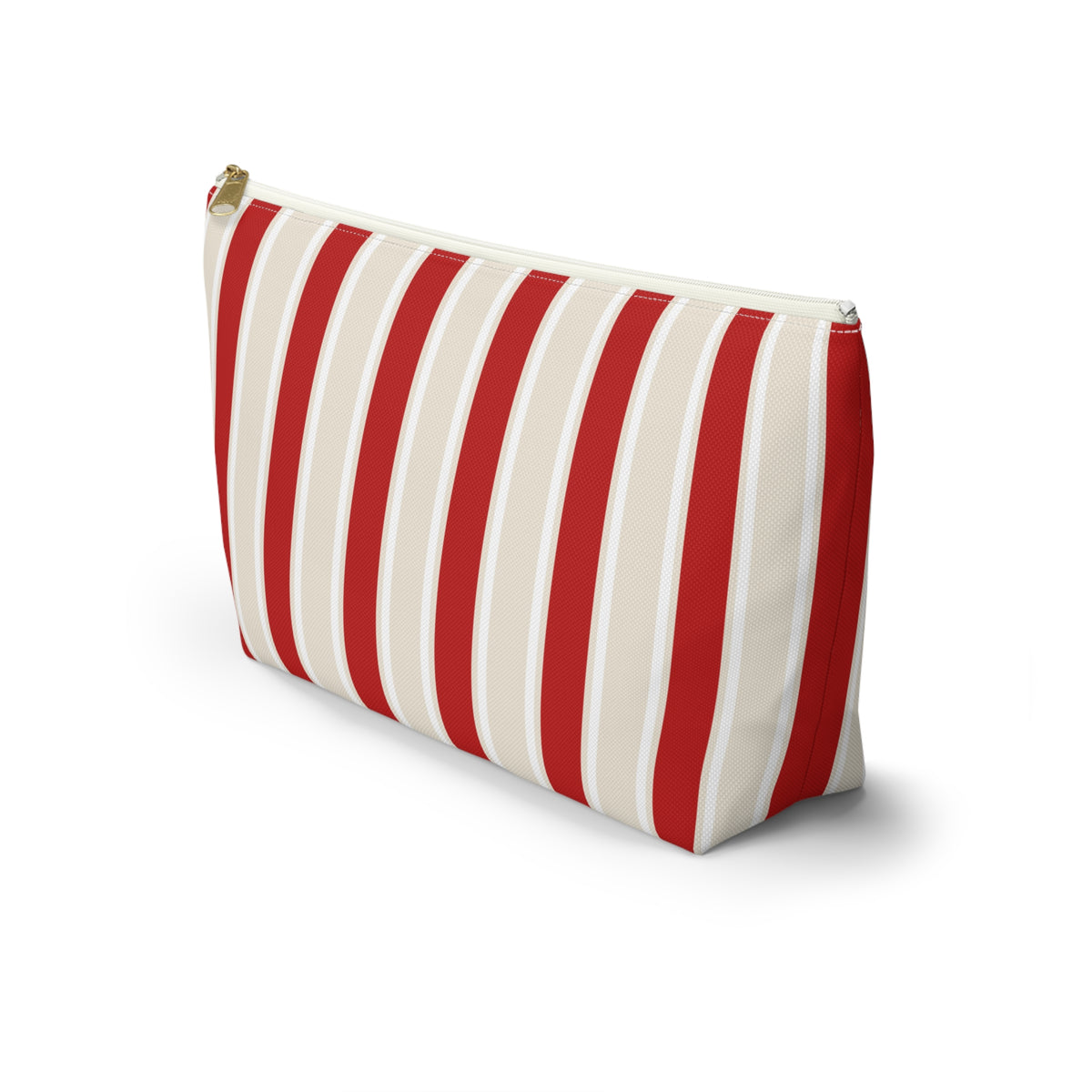 Side view of the red cream striped makeup bag standing on a white background