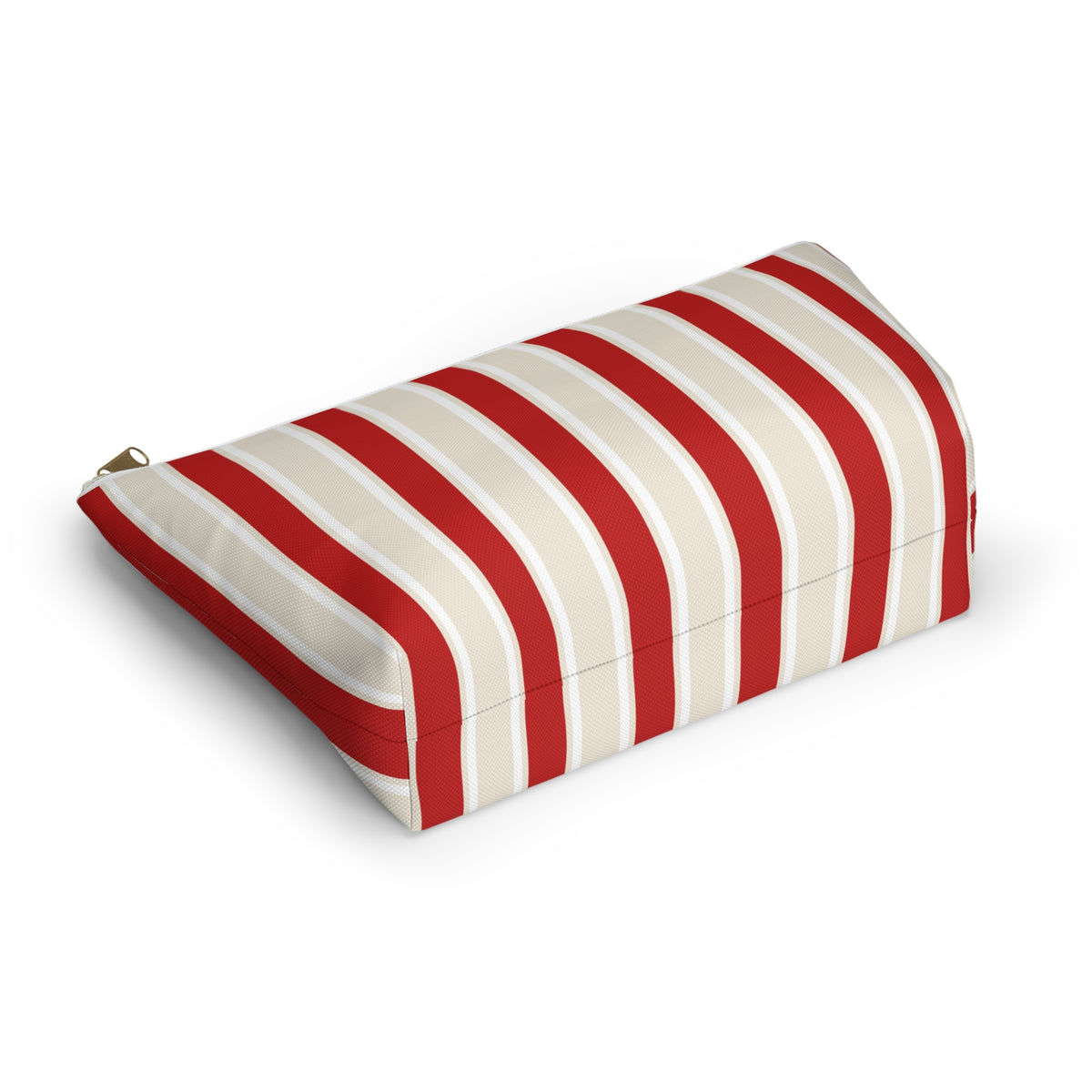 Red cream striped makeup bag lying on its side showing the bold stripes