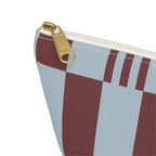 Close-up of the gold zipper pull on the sky blue burgundy block striped makeup bag
