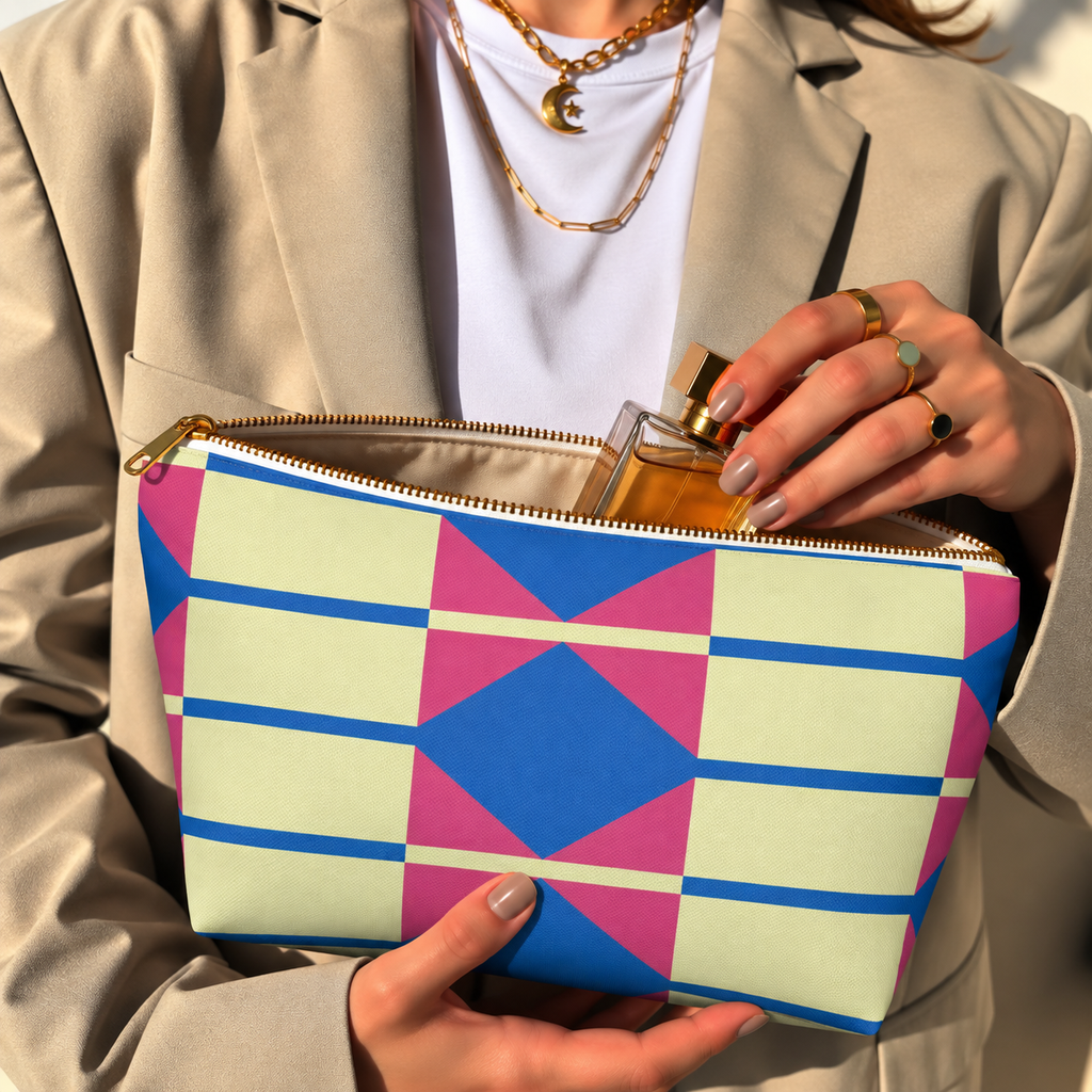 Model opening the yellow pink blue geometric makeup bag to take out a perfume bottle