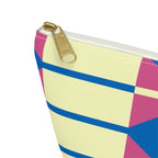 Close-up of the gold zipper pull and yellow, pink and blue geometric print on the makeup bag